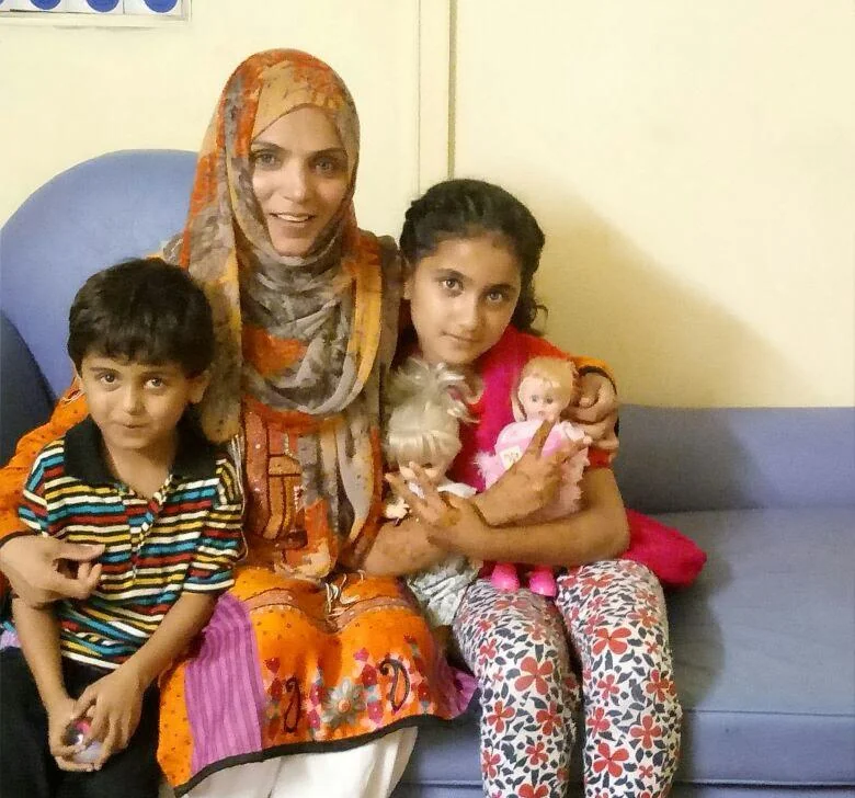 Dr. Amna Amber with children at BIWS orphanage